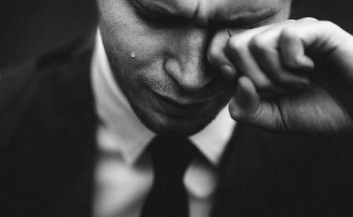 Man crying in business suit